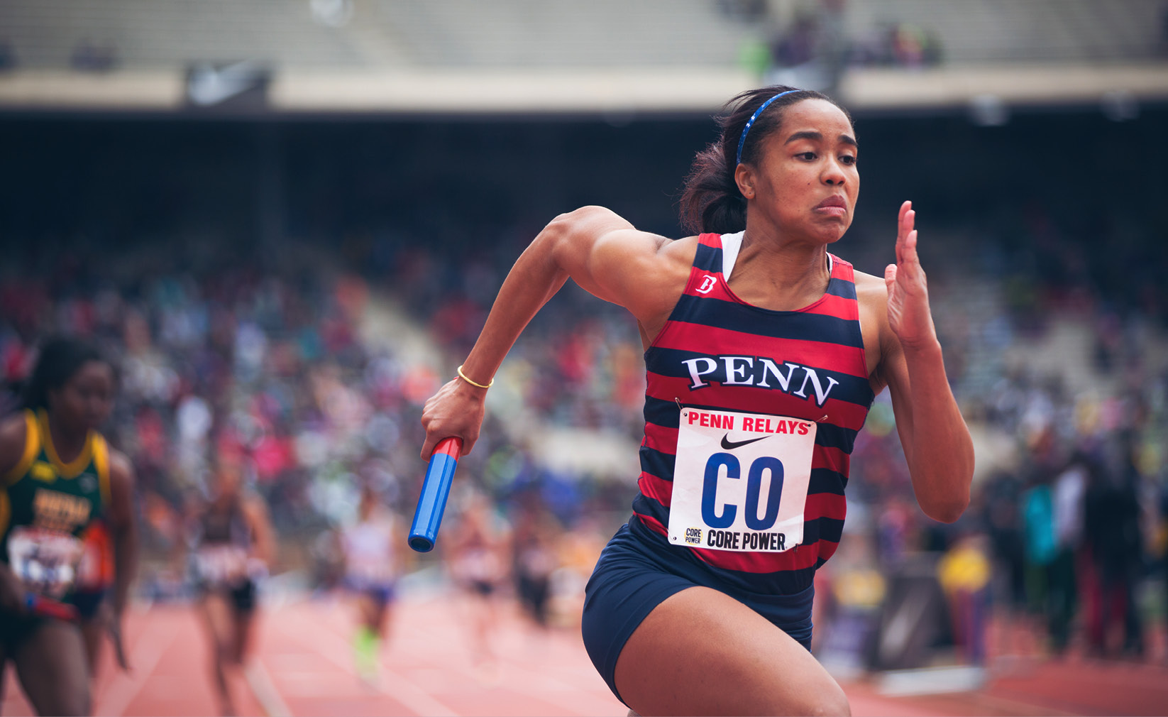 Penn relay sprinter running toward the finish line.