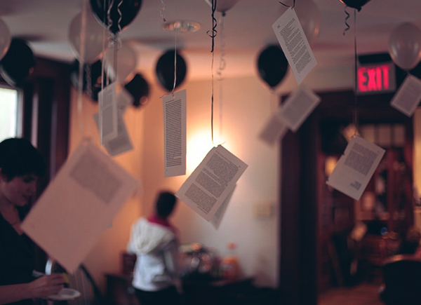 Sheets of paper hanging from the ceiling inside the Kelly Writers House.