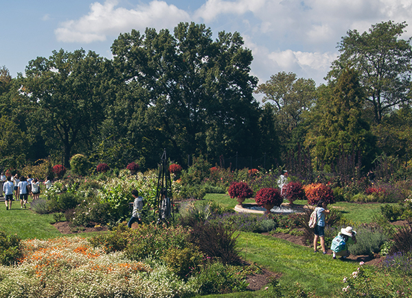 People enjoying the gardens at Morris Arboretum.