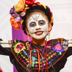 October Playlist girl wearing day of the dead face paint