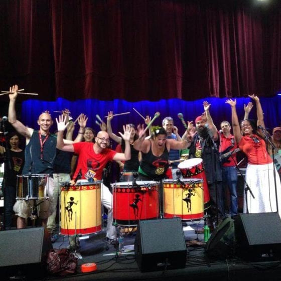 July Playlist band on stage waving