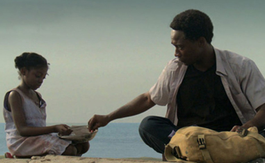 man and girl sitting on the ground