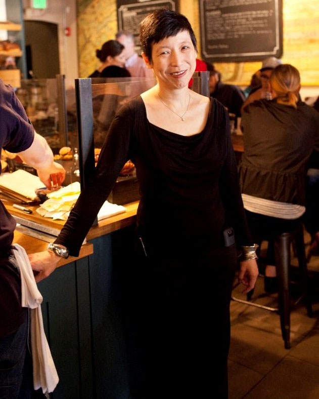 asian woman standing in black dress