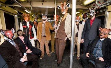 group of people in a subway car wearing animal masks