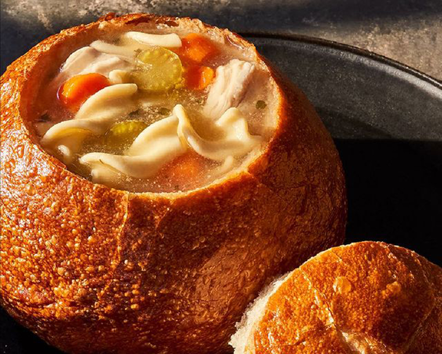 chicken noodle soup in a bread bowl