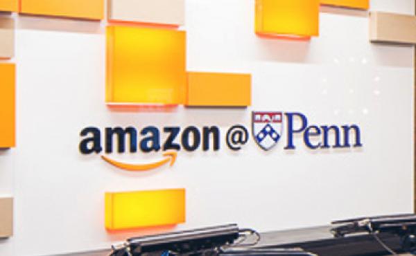 Amazon@Penn logo above a reception desk.