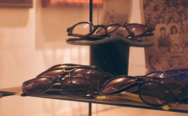 Eyeglasses in a glass display case in the retail store the Modern Eye.