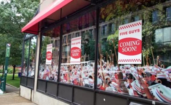 five guys posters in window