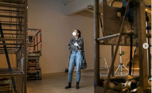 Artist Jessica Vaughn standing in the middle of her exhibition space at ICA