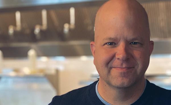 bald man in kitchen