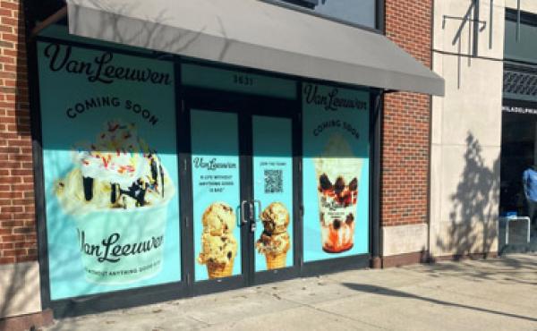 store front with van leeuwen signage in the windows