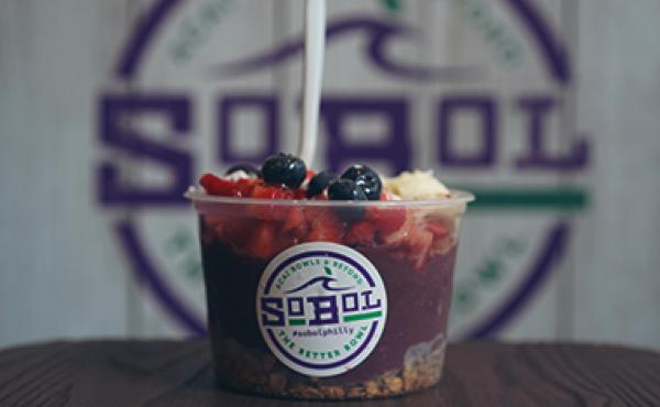 purple acai bowl with sobol logo in background