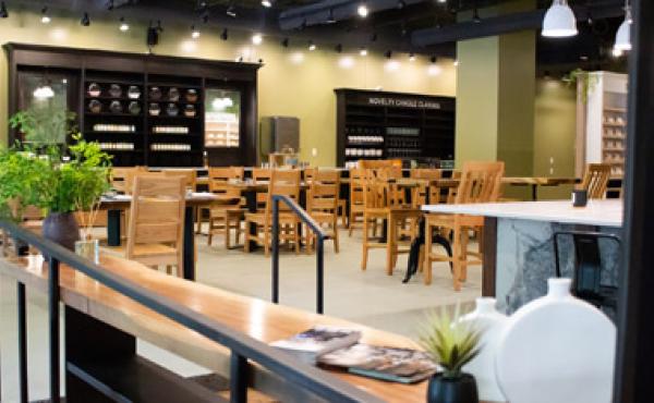 empty store space with tables and chairs set up