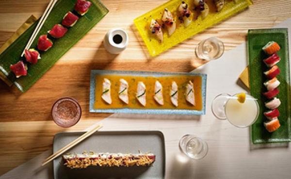 japanese food on dishes arranged on a table