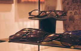 Eyeglasses in a glass display case in the retail store the Modern Eye.