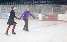 Two individuals enjoy ice skating at Penn Ice Rink