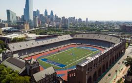 empty stadium with city skyline behind