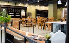 empty store space with tables and chairs set up