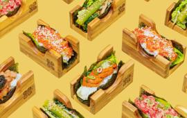 sushi rolls on a yellow mustard background