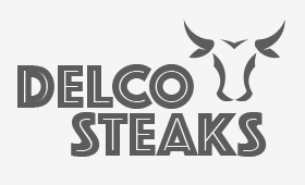 Delco Logo words delco steaks with an illustration of a bull head next to the word delco